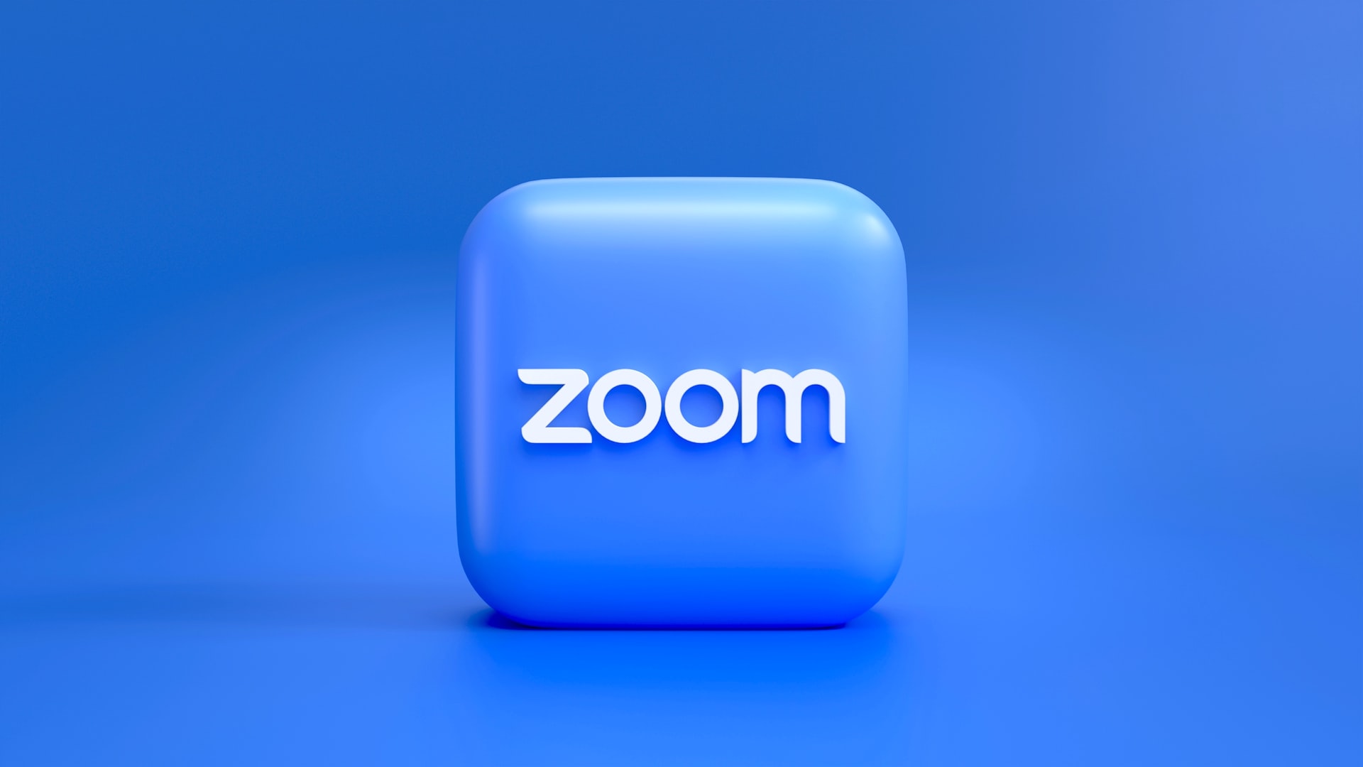 a blue square button with the word zoom on it